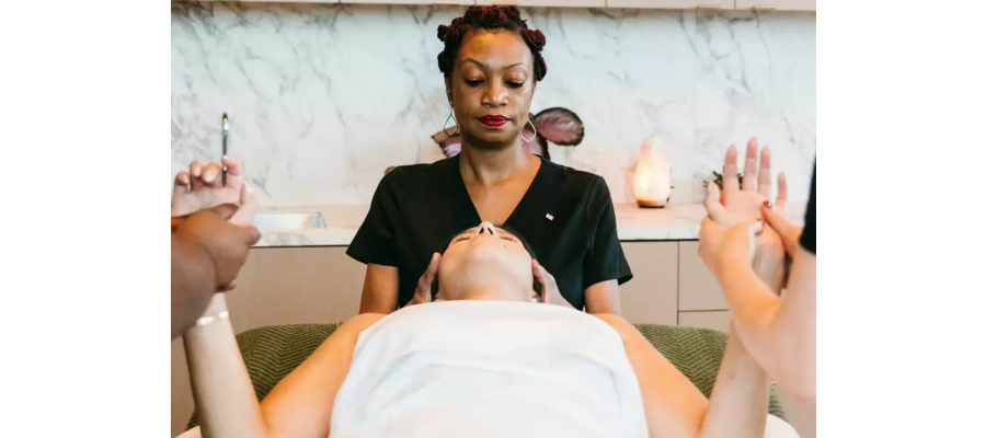 In this Houston hotel spa massage, 3 people work in harmony