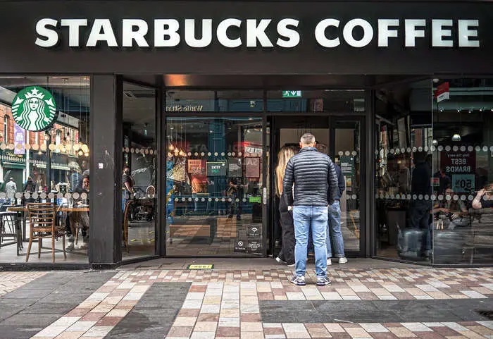 Starbucks promises its new 'siren system' will cut the wait for your drink but most stores are still waiting for the rollout